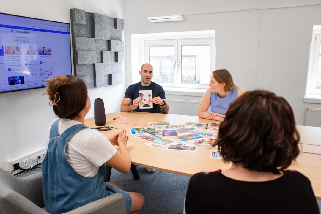 Diverse media team brainstorming in a bright meeting room