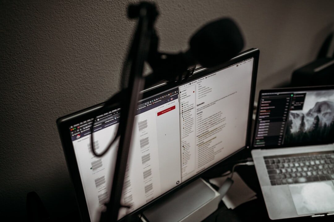Digital journalist producing online news content on multiple screens